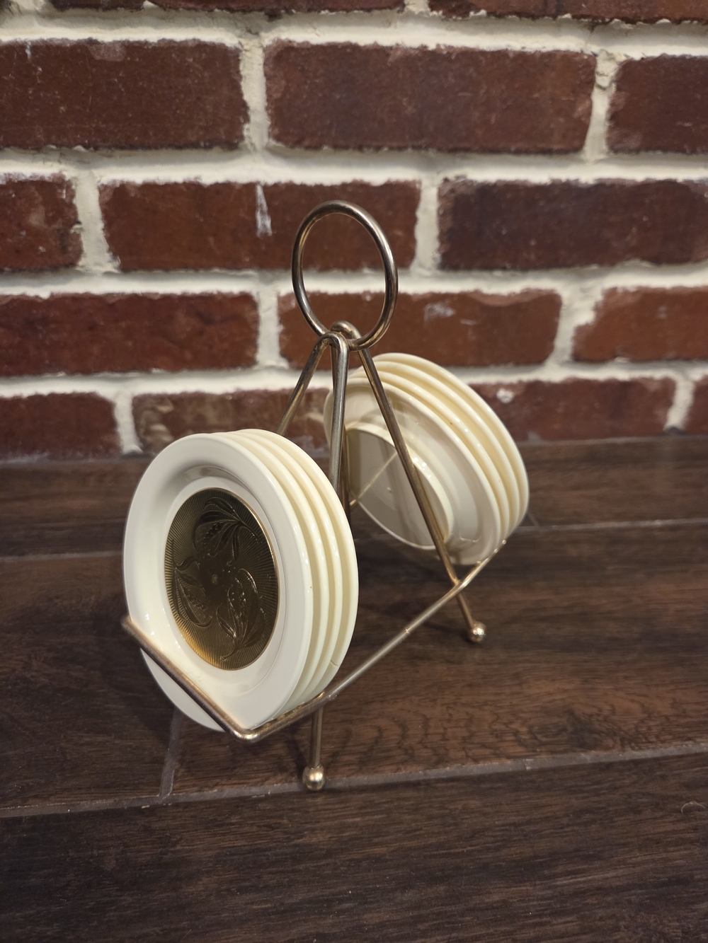 Vintage set of 8 Gold plastic coasters and Holder
